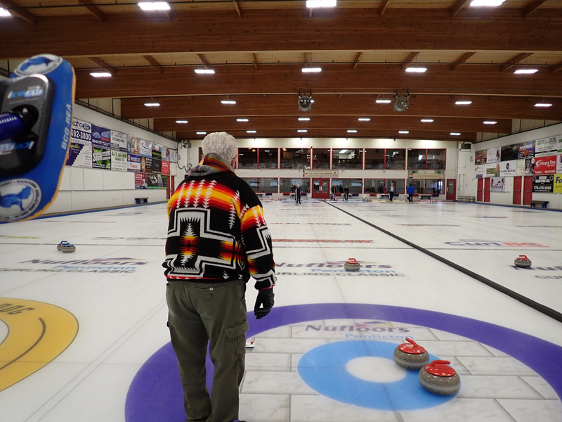 Curling rink with a BCGREA broom